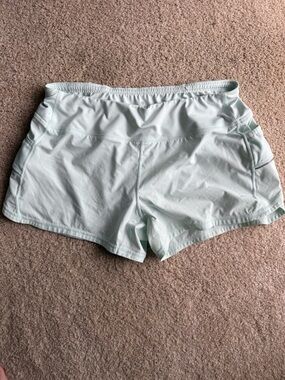 Athleta Mint Green Running Shorts L Built In Liner Zip Pocket